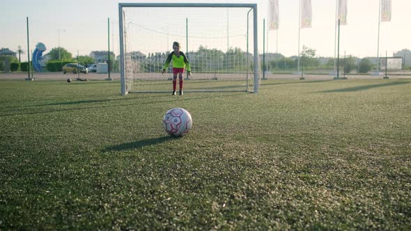 Young Goalkeeper Misses Ball Kicked By Friend