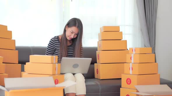 Woman with packing box ready for shipping