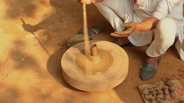 Potter at Work Makes Ceramic Dishes