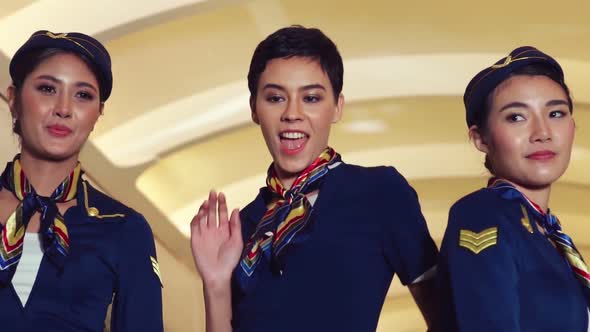 Cabin Crew Dancing with Joy in Airplane