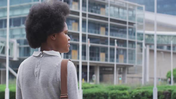 African american businesswoman walking in city