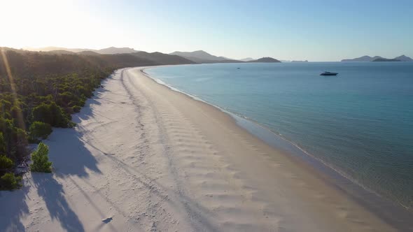 Whitehaven Beach Whitsundays vertical aerial with white sand and lens flare, Queensland