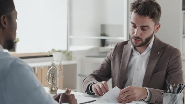 Lawyer Giving Contract to Client