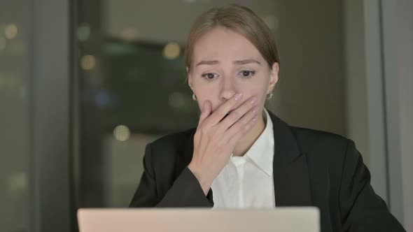 Close Up of Businesswoman Get Shocked on Office Desk at Night