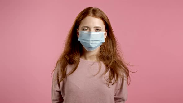 Pleased Woman Removed Protective Mask and Throws It on Floor As Symbol of Pandemic, Epidemic End