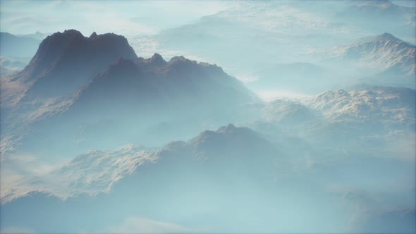 Distant Mountain Range and Thin Layer of Fog on the Valleys alt