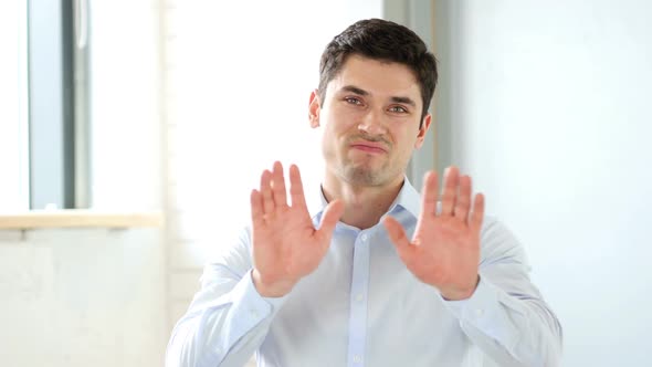 Man in Office Rejecting Offer Indoor