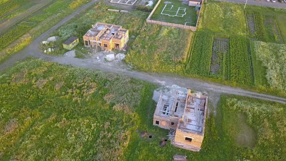 Aerial view od new brick unfinished house under construction