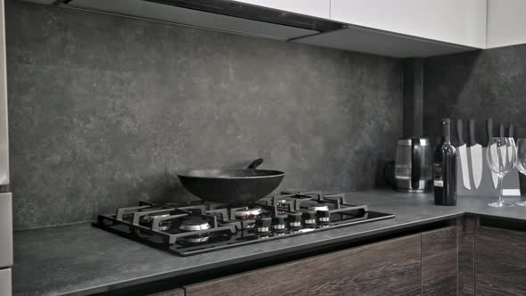 Gas Stove Top at Modern Dark Brown Gray and Black Kitchen