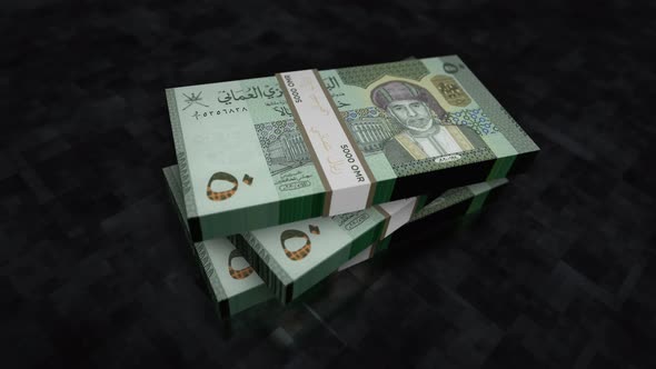 Oman Rial money banknote pile packs