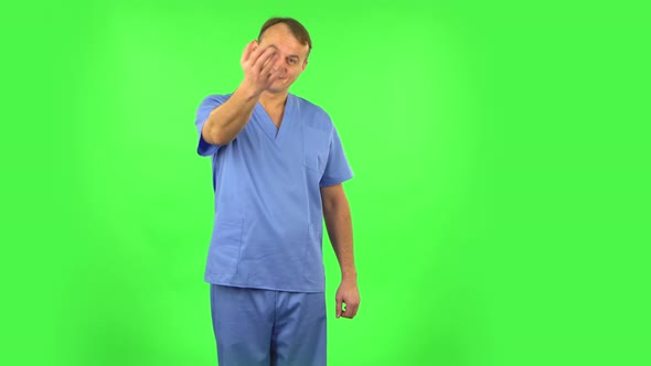 Medical Man Waving Hand and Showing Gesture Come Here, Green Screen