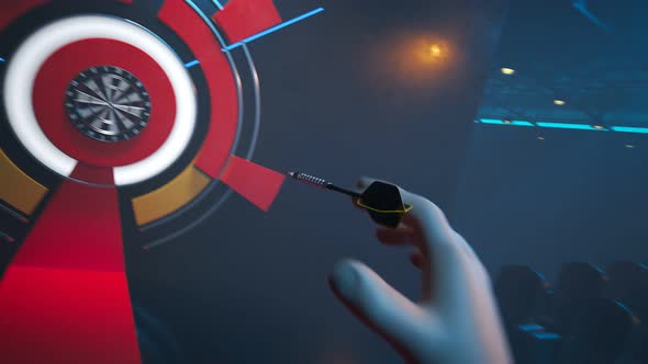 Player throwing a dart hitting perfectly in the bullseye of the dartboard.