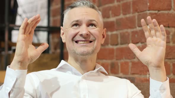 Portrait of Screaming Upset Middle Age Man in Office