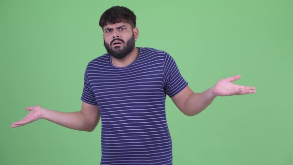 Young Overweight Bearded Indian Man Waving Hand No