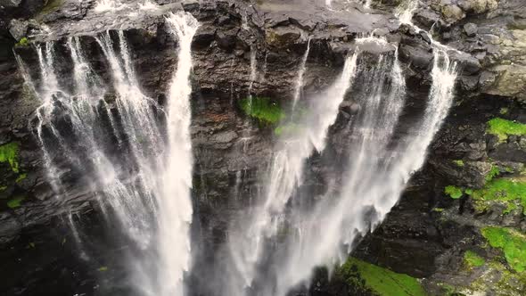 Aerial view above of breathtaking Fossa waterfall, Faroe Island.