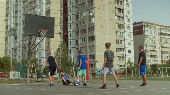 Defender Committing a Foul During Streetball Game