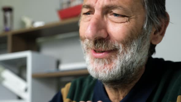 Old Man Working On Laptop alt