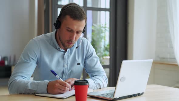 Young Man Student Study at Home Using Laptop and Learning Online