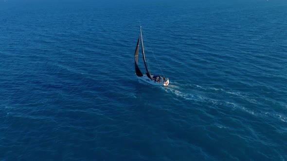 Aerial View. Sailing Yachts with White Sails in the Open Sea.