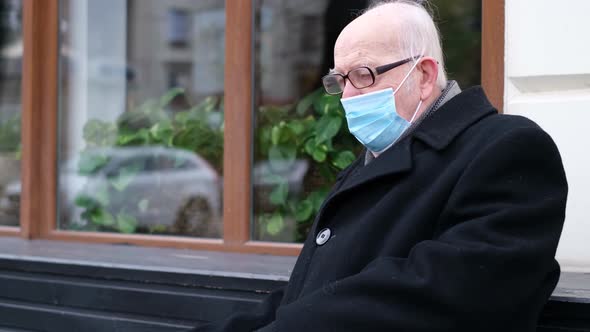 The Old Grandfather Coughed a Lot While Sitting on the Bench He Got the Flu