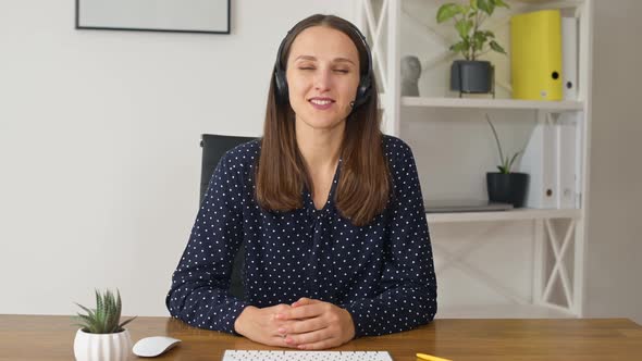 Video Chat with Female Colleague Wearing Headset