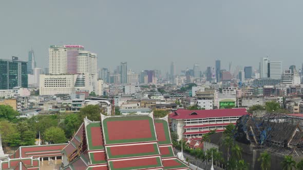 4K Urban landscape shot of a panoramic view of Bangkok, Thailand on a sunny day, from the top of the