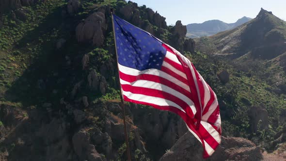 USA Flag on a Flagpole.  Aerial of the American Flag Is Fluttering on a Wind