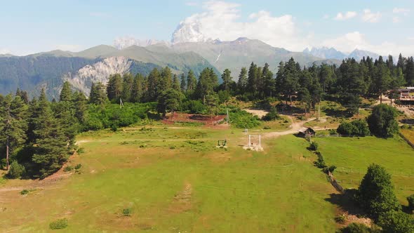 Birds Eye View Of Heshkili Huts With Mountain Panorama