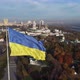 the national flag of Ukraine and the statue of liberty over Kyiv, panorama right - VideoHive Item for Sale