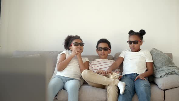Cute Children in 3d Glasses Watching Movie on Couch