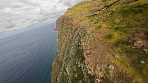 FPV Racing Drone Mountain Surfing and Cliff Diving Along the Rocks