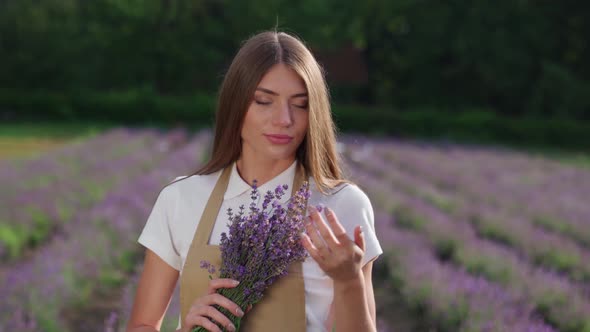 Charming Girl Making Deep Breath in Lavender Field