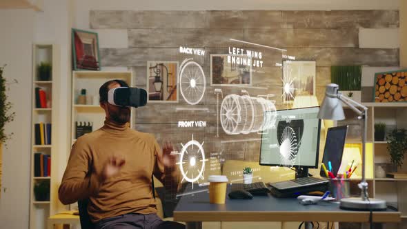 Male Engineer in Home Office Using VR Headset To Study the Functionality of Turbine Prototype