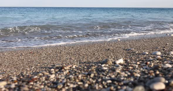 Water Recedes From Stones and Sea Beach