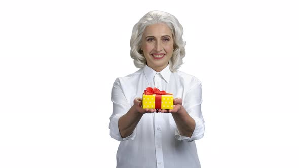 Smiling Woman Giving Present Box on White Background