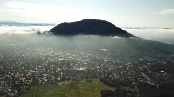Aerial panning Berapit Town over the thin fog at Malaysia
