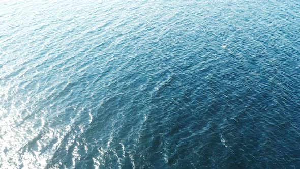 Flight over the ocean. Aerial ocean view. Top fly over the sea.