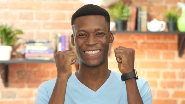 Successful Black Young Man Celebrating Success