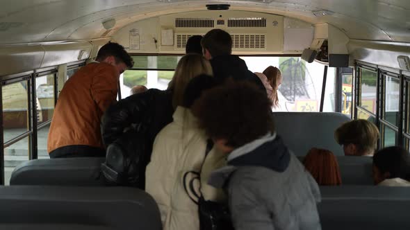 Multiethnic Teenage Pupils Leaving School Bus