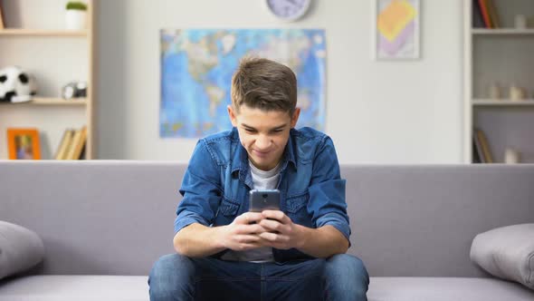 Emotional Teenage Boy Winning Money in Sport Gambling, Online Application