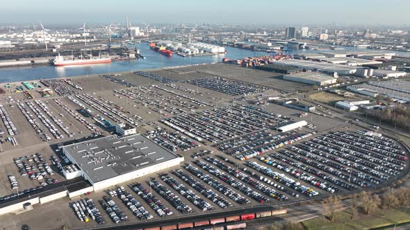 Aerial of a Automotive Car Terminal Parking Lot Storage Loading Area Ready for Distribution in the