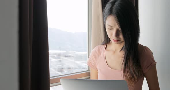 Woman working on laptop computer 