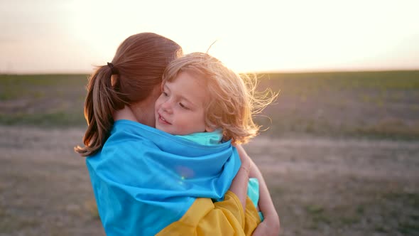 Ukrainian Family  Loving Smiling Son Hugs Mom Tightly