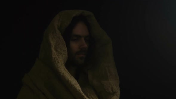 Jesus Christ in Robe Looking at Camera Isolated on Dark Background, Son of God