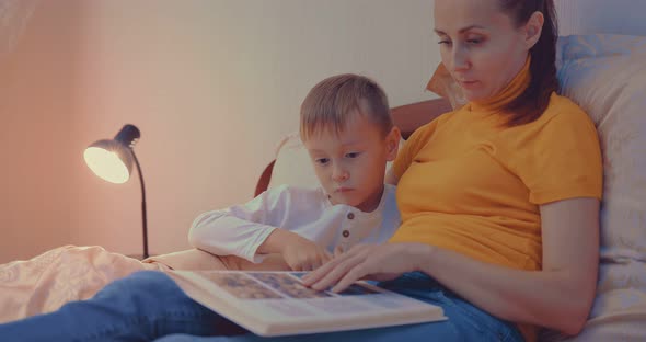 Mother and Son in Bed at Night