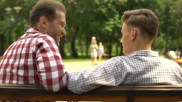 Bearded Father Communicating With Teenage Son