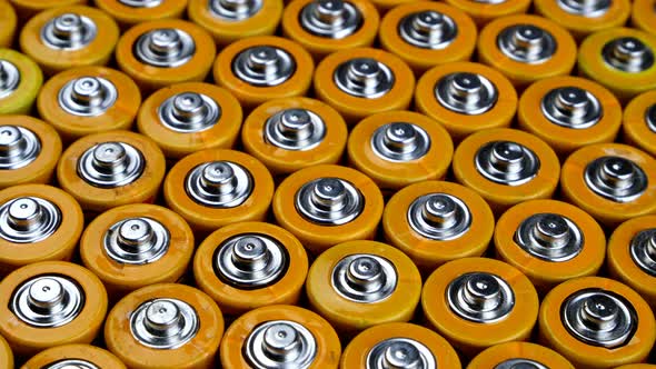 Many Used AA Alkaline Batteries Finger Batteries in Heap Ready for Recycling