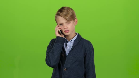 Boy Is Talking on the Phone and Screaming. Green Screen