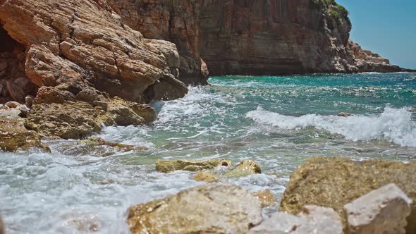 Slow Motion Footage Tropical Island and Sea Waves Crashing and Foaming Against Rocky Beach