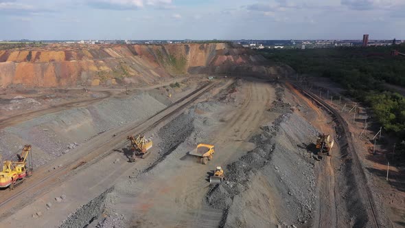 Large Mining Dump Truck Near the Open Quarry 